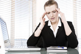 Woman at work with a headache
